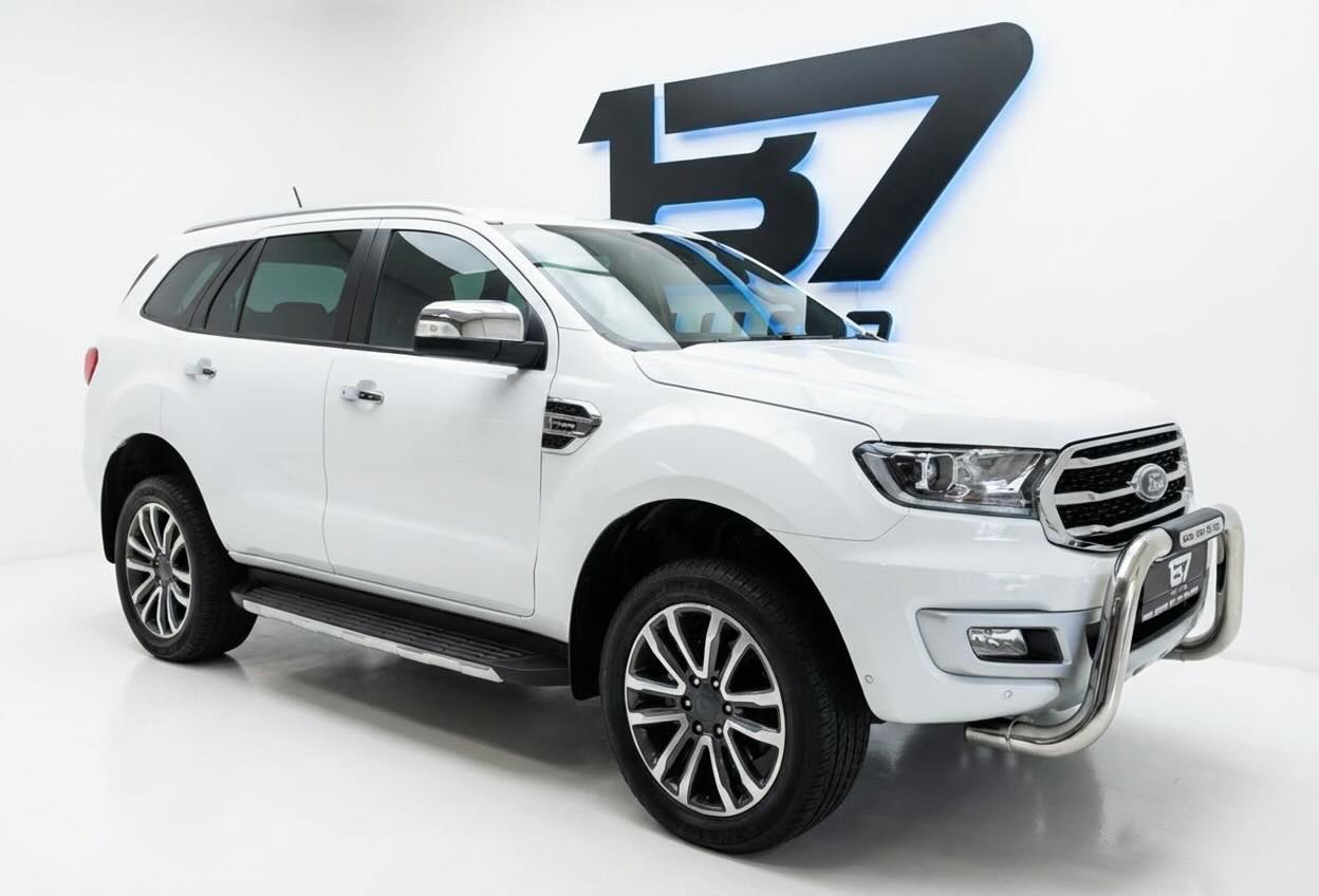 White Ford Everest SUV with clean studio background and preserved 137 branding after enhancement